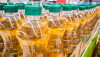 Bottles of oil on counter in shop, Pattern of vegetable oil bottles at factory warehouse store or supermarket_photo by sirirat via AdobeStock_821696498.jpg